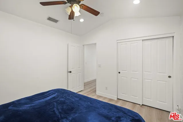 a view of a house with pool and sitting area