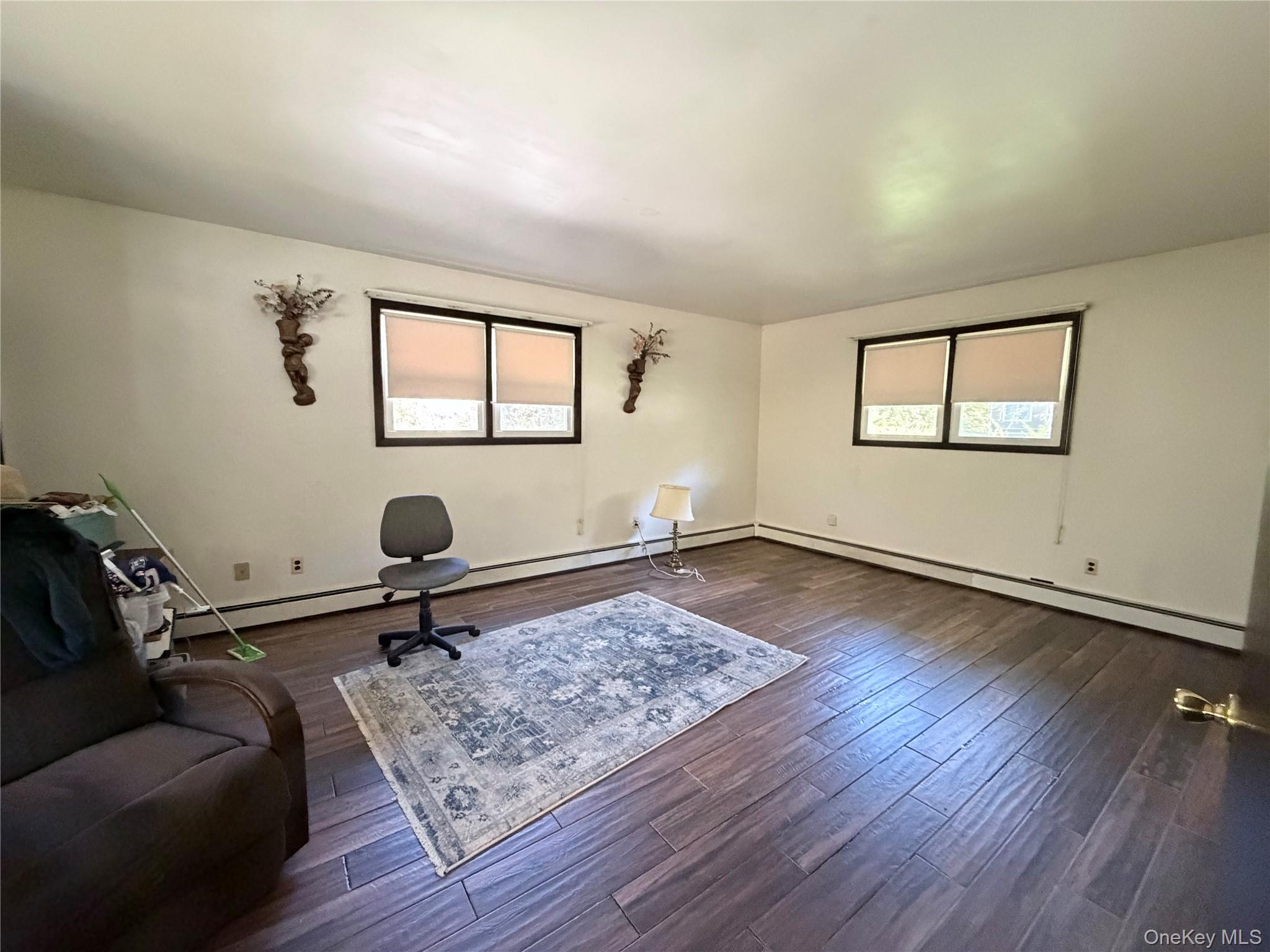 421 Nelson Road Monroe, NY 10950 - Photo 14 of 28 a living room with furniture and a rug