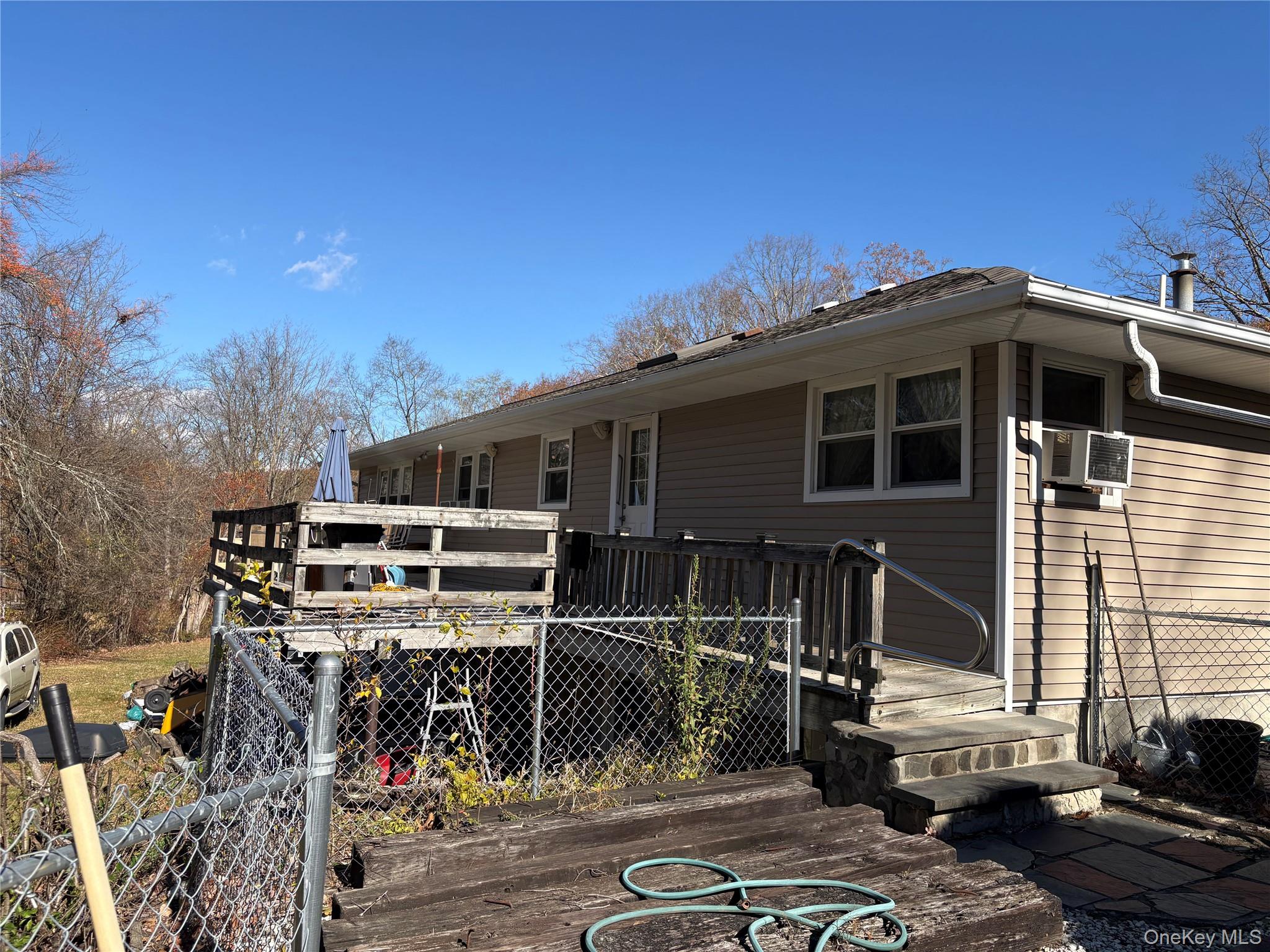 421 Nelson Road Monroe, NY 10950 - Photo 22 of 28 a view of a house with wooden deck