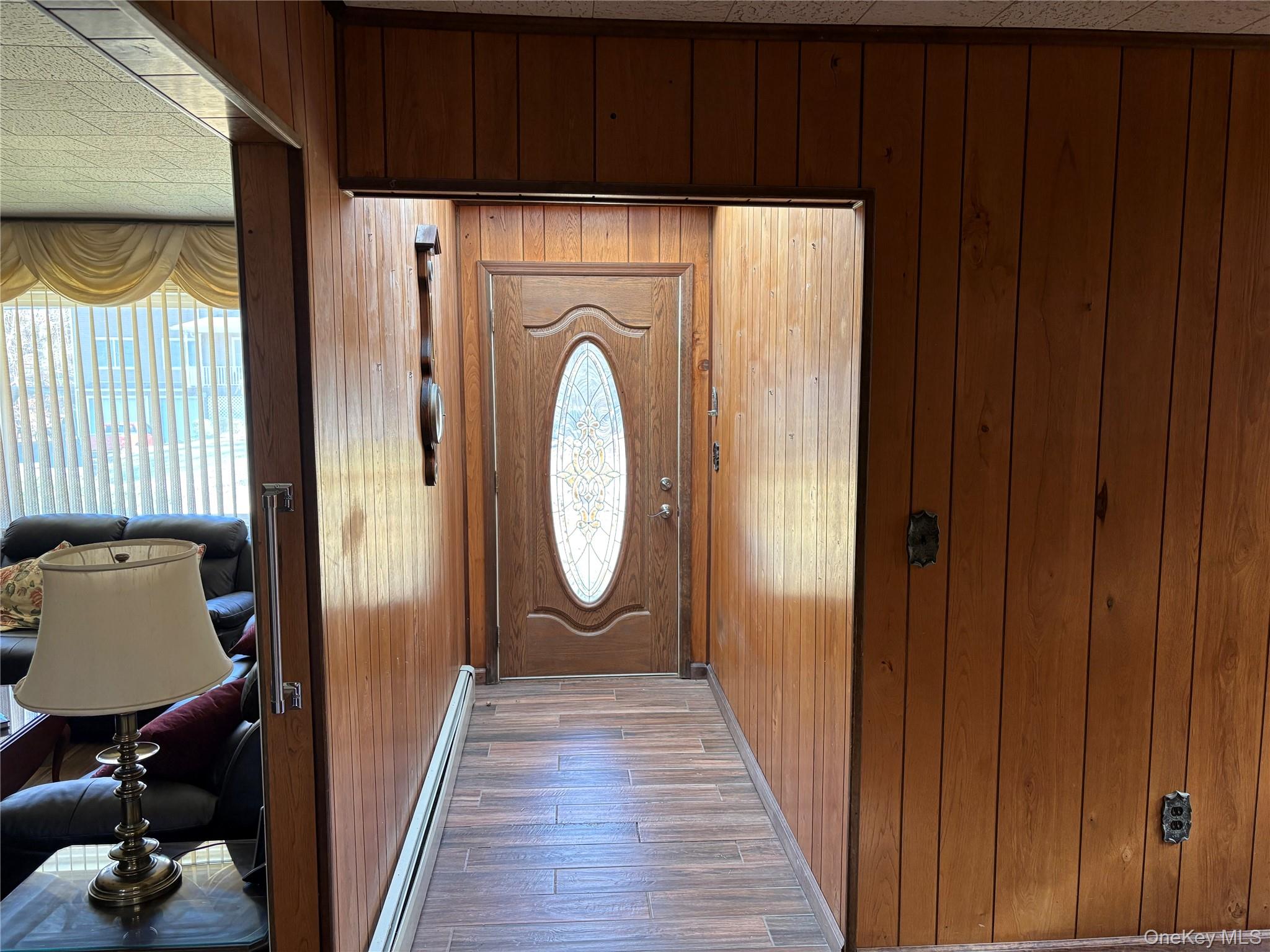 421 Nelson Road Monroe, NY 10950 - Photo 3 of 28 a view of a hallway with wooden floor and closet
