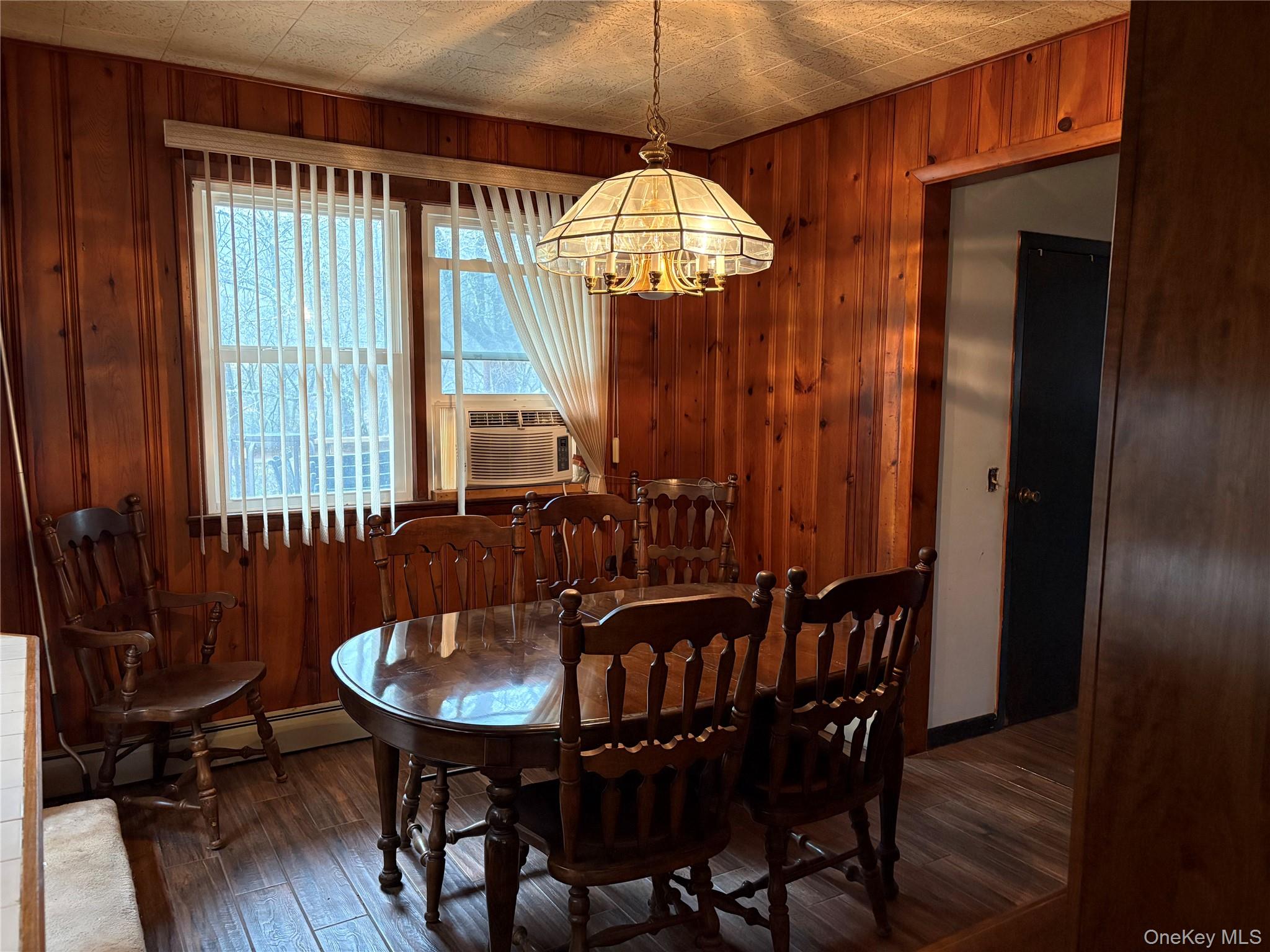 421 Nelson Road Monroe, NY 10950 - Photo 10 of 28 a view of a dining room with furniture window and wooden floor