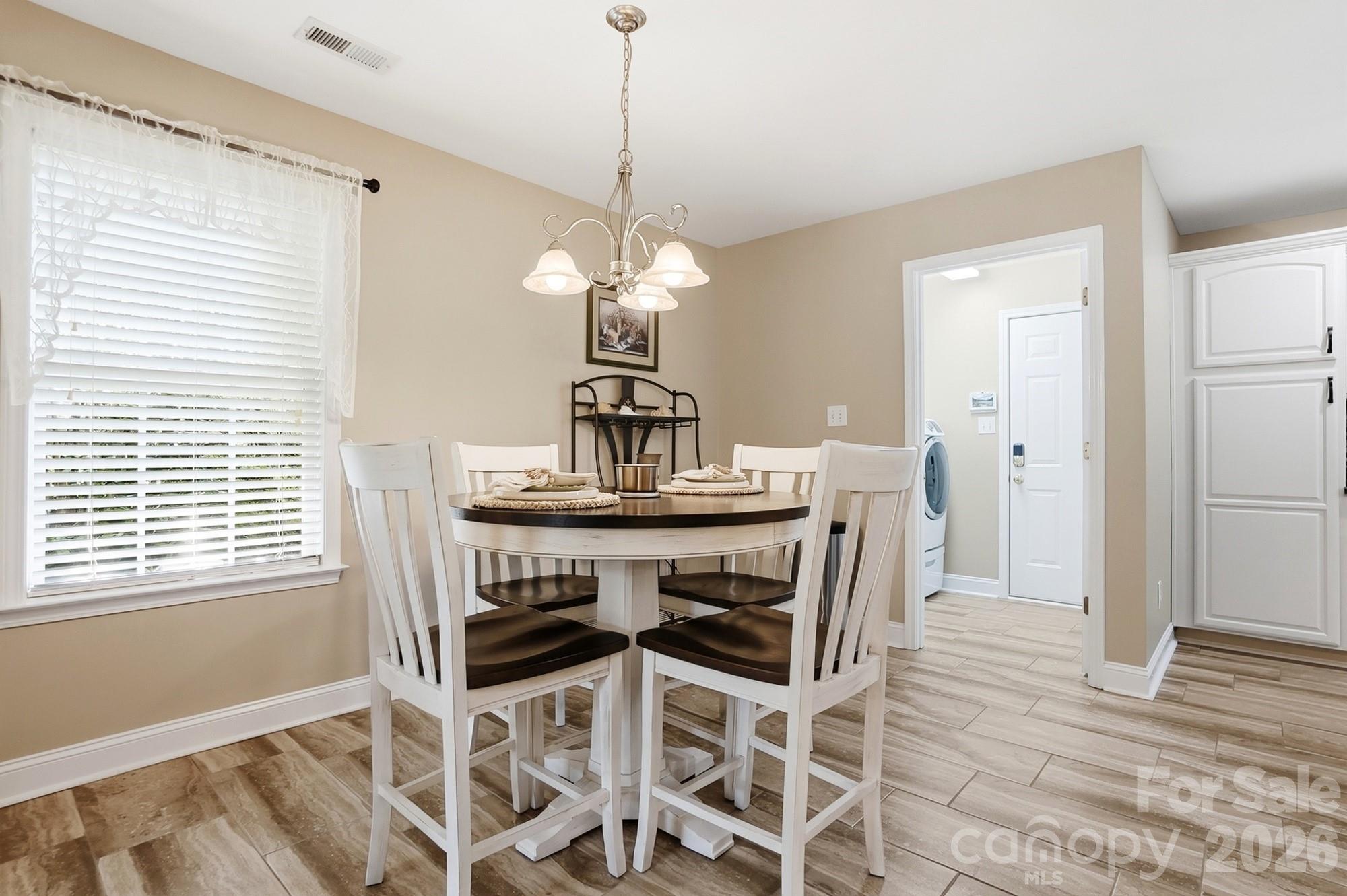 3324 Muddy Creek Road Midland, NC 28107 - Photo 18 of 46 a dining room that has a dining table and chair