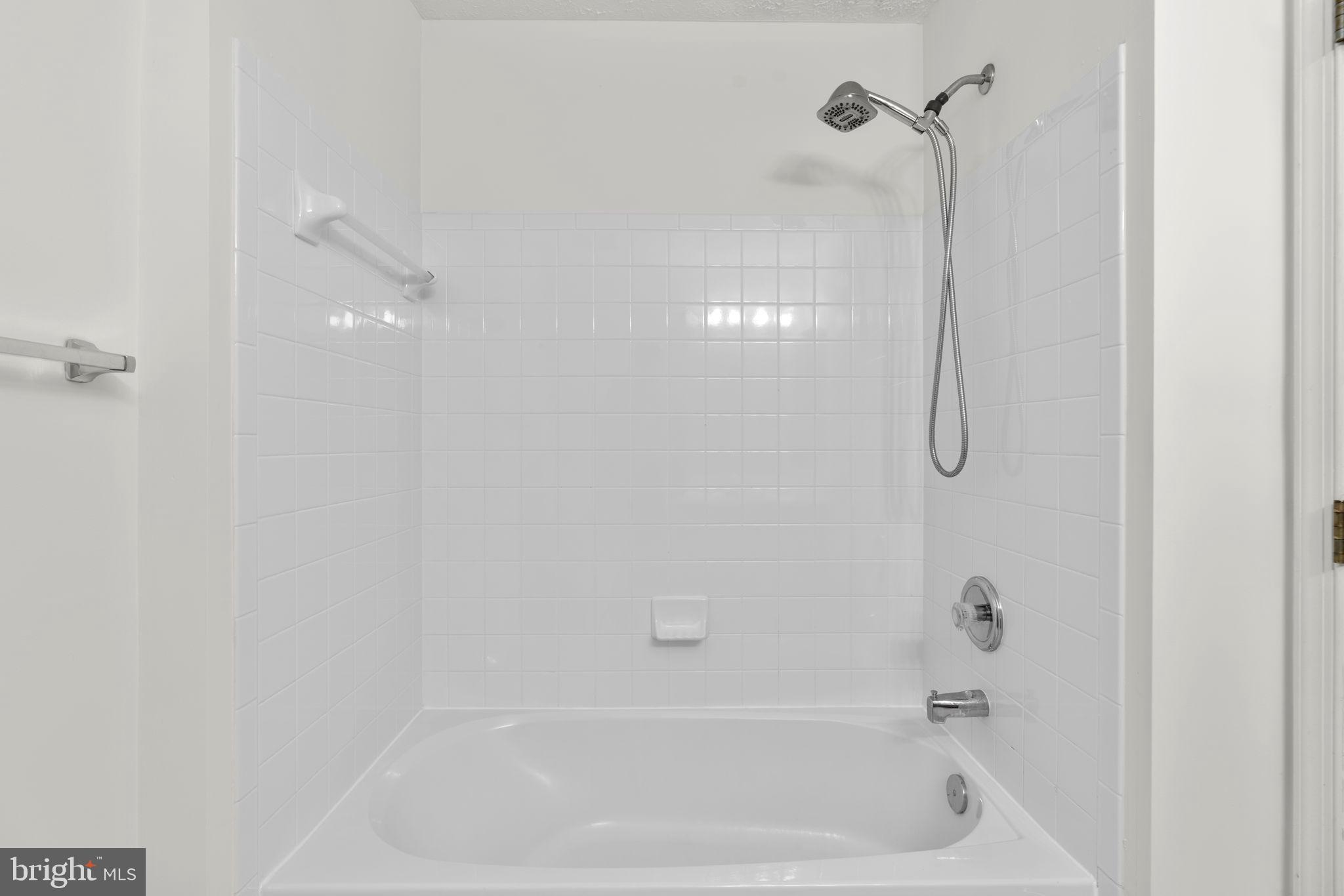 2444 Blue Spring Court, Unit 203 Odenton, MD 21113 - Photo 23 of 36 a close view of a bathtub in bathroom