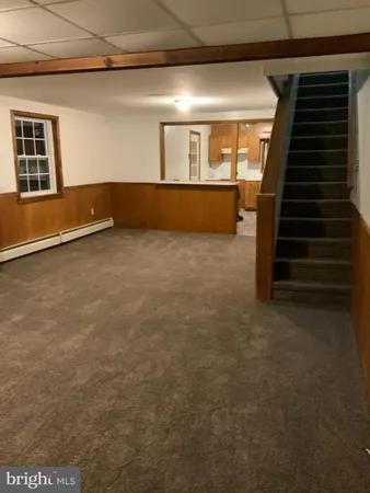 a view of an empty room with stairs