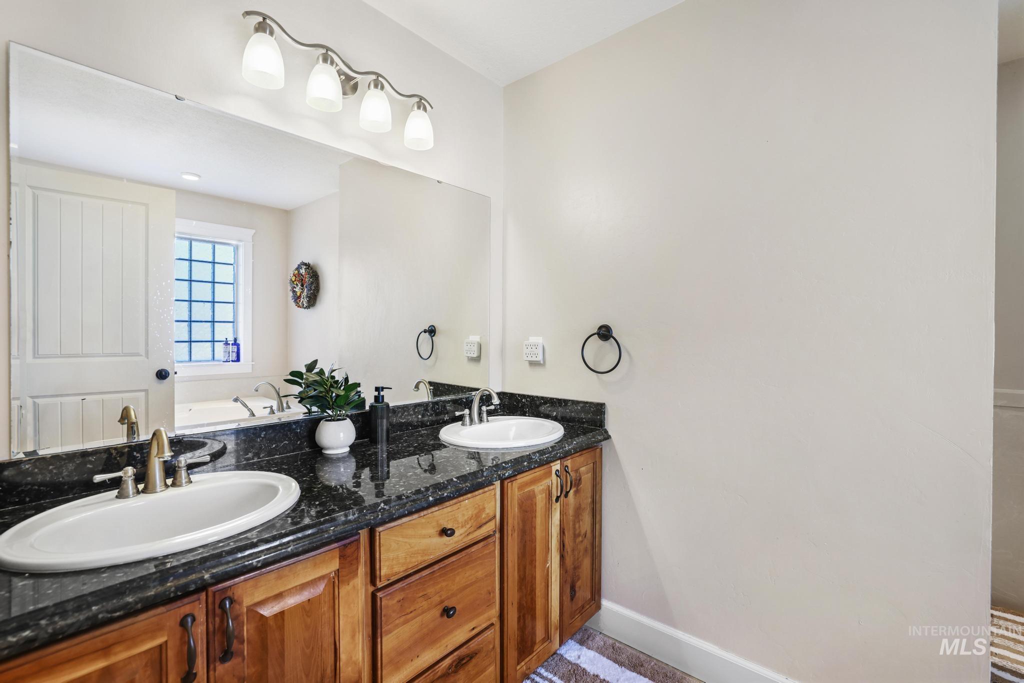 1111 Cole Street Kimberly, ID 83341 - Photo 21 of 46 Full bathroom featuring double vanity and a bath
