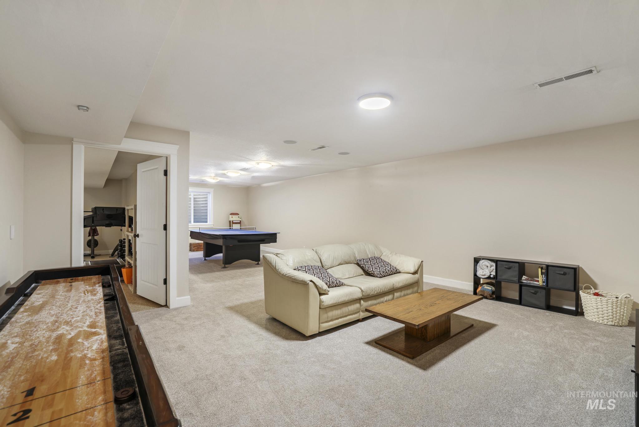 1111 Cole Street Kimberly, ID 83341 - Photo 32 of 46 Living area with light colored carpet and baseboards