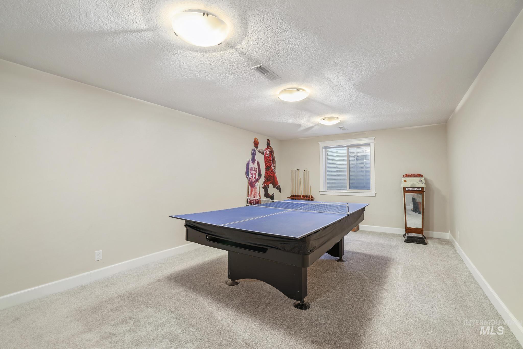 1111 Cole Street Kimberly, ID 83341 - Photo 33 of 46 Playroom with light colored carpet and a textured ceiling