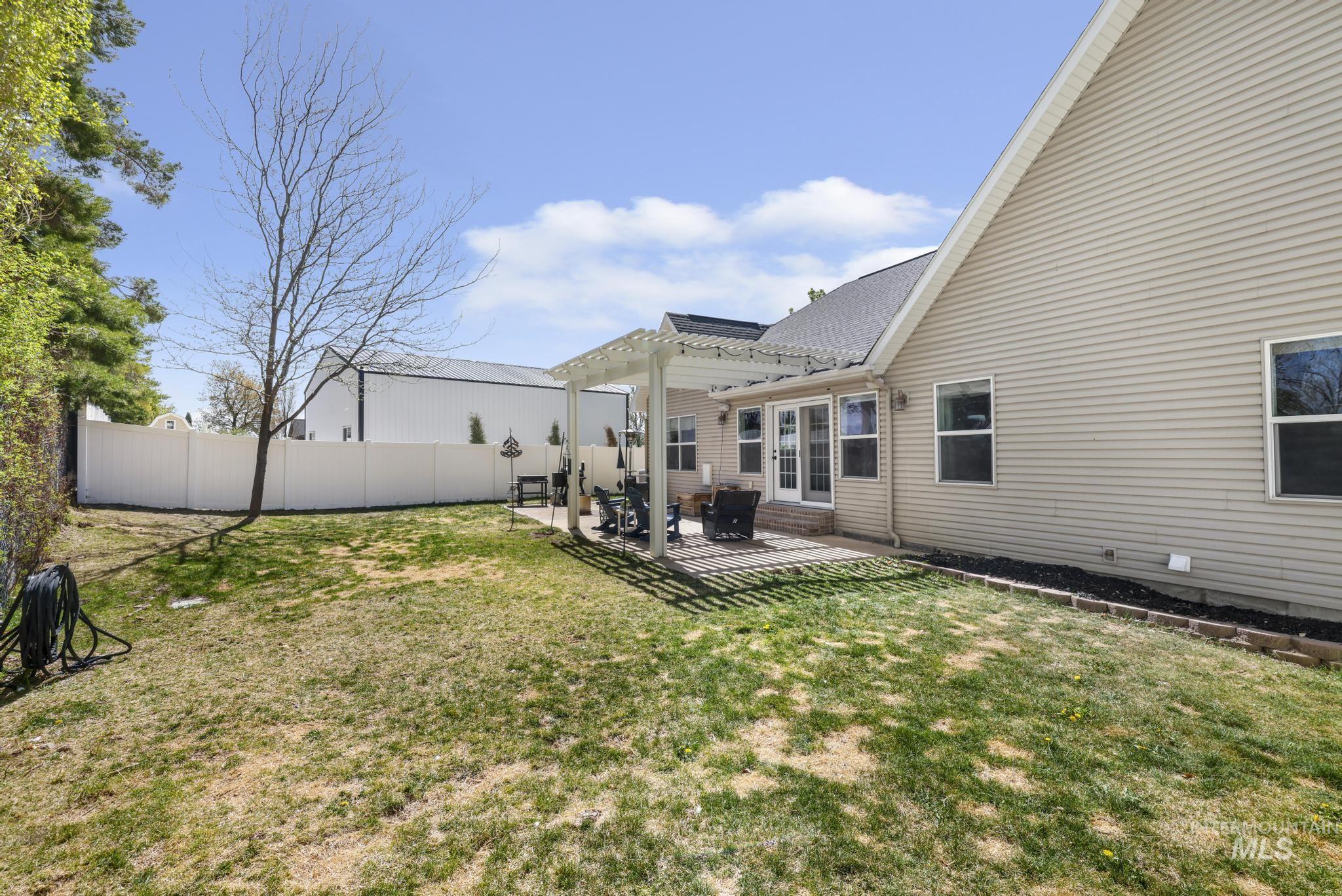 1111 Cole Street Kimberly, ID 83341 - Photo 41 of 46 Fenced backyard featuring a pergola and a patio