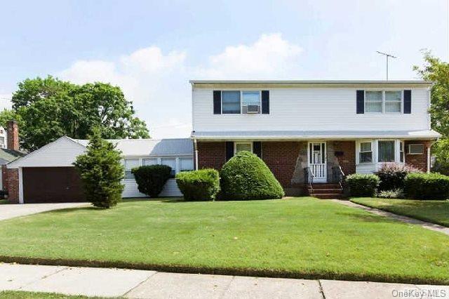 400 Sherbourne Road Valley Stream, NY 11580 - Photo 1 of 1 a view of a brick house with a yard