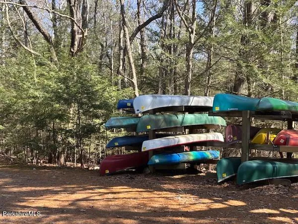 a view of a table and chairs under an umbrella