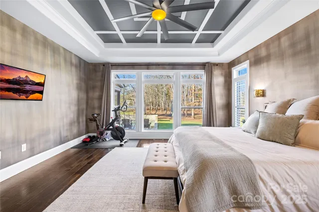 a spacious bathroom with a double vanity sink mirror and bathtub