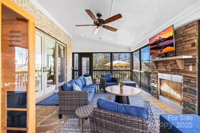 an aerial view of a house with a garden and swimming pool