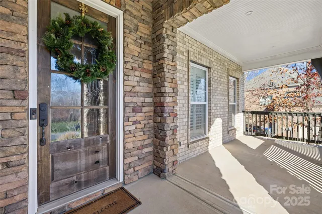 a kitchen view with table and potted plant