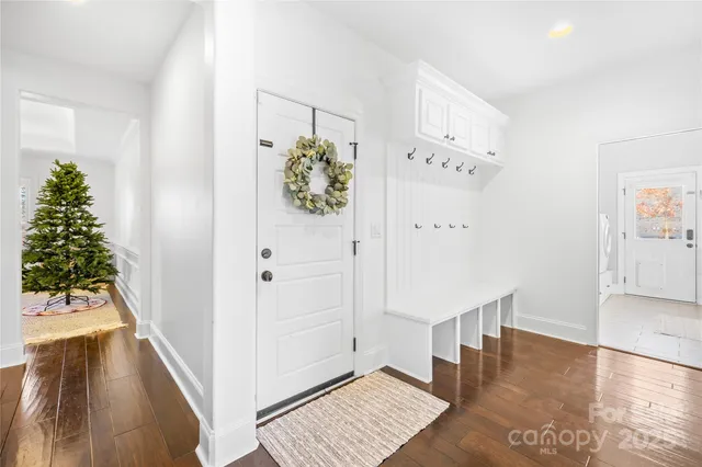 a large white kitchen with lots of counter top space