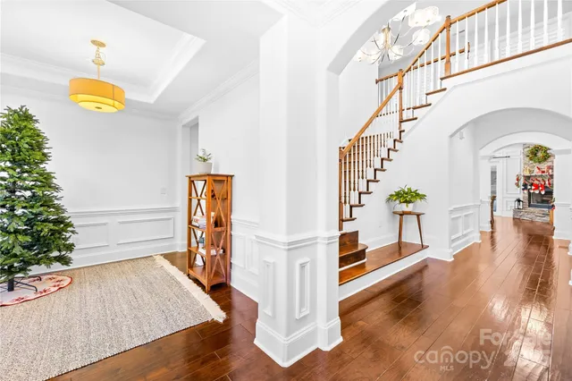 a large kitchen with lots of counter space and wooden floor