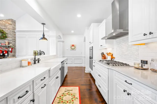 a living room with furniture fireplace and a window