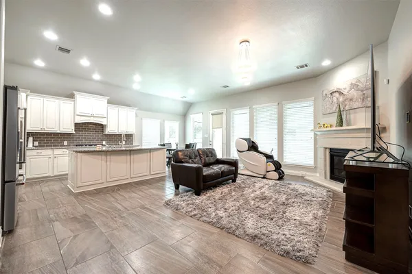 a living room with granite countertop furniture and fireplace
