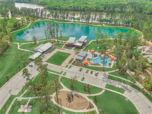 an aerial view of a house with a lake view