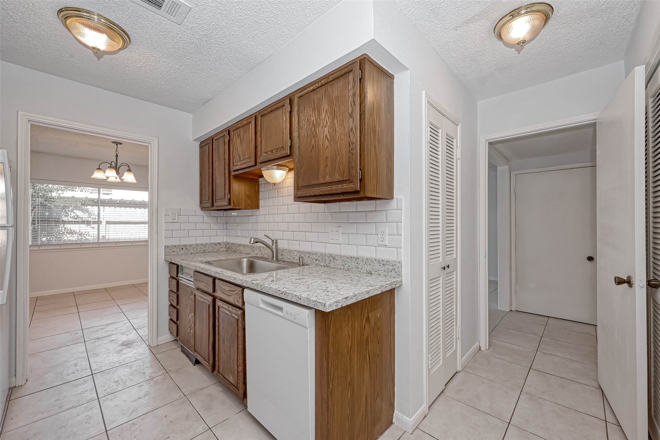 14179 Misty Meadow Lane Houston, TX 77079 - Photo 18 of 41 a kitchen with stainless steel appliances granite countertop a sink and a stove