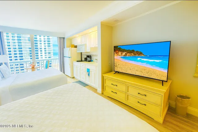 a bedroom with a bed and a dresser