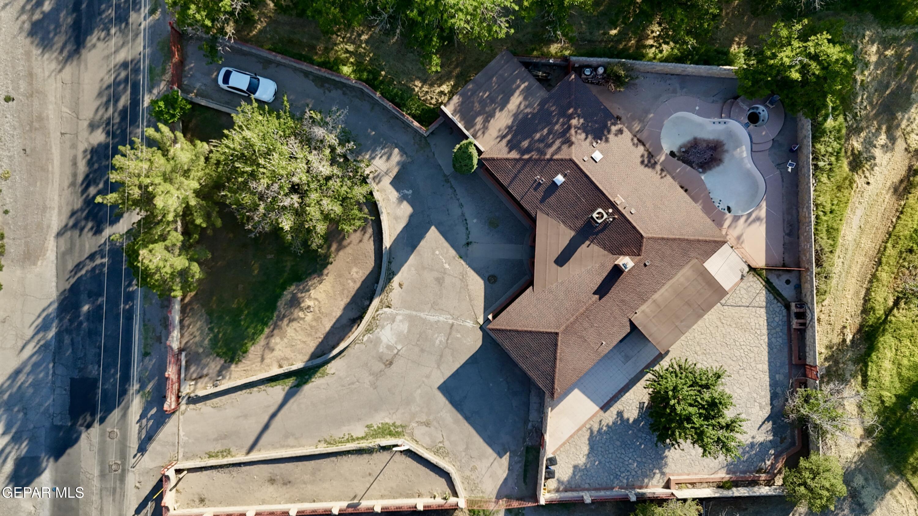 875 Le Barron Road El Paso, TX 79907 - Photo 11 of 14 an aerial view of a house with a yard and garden