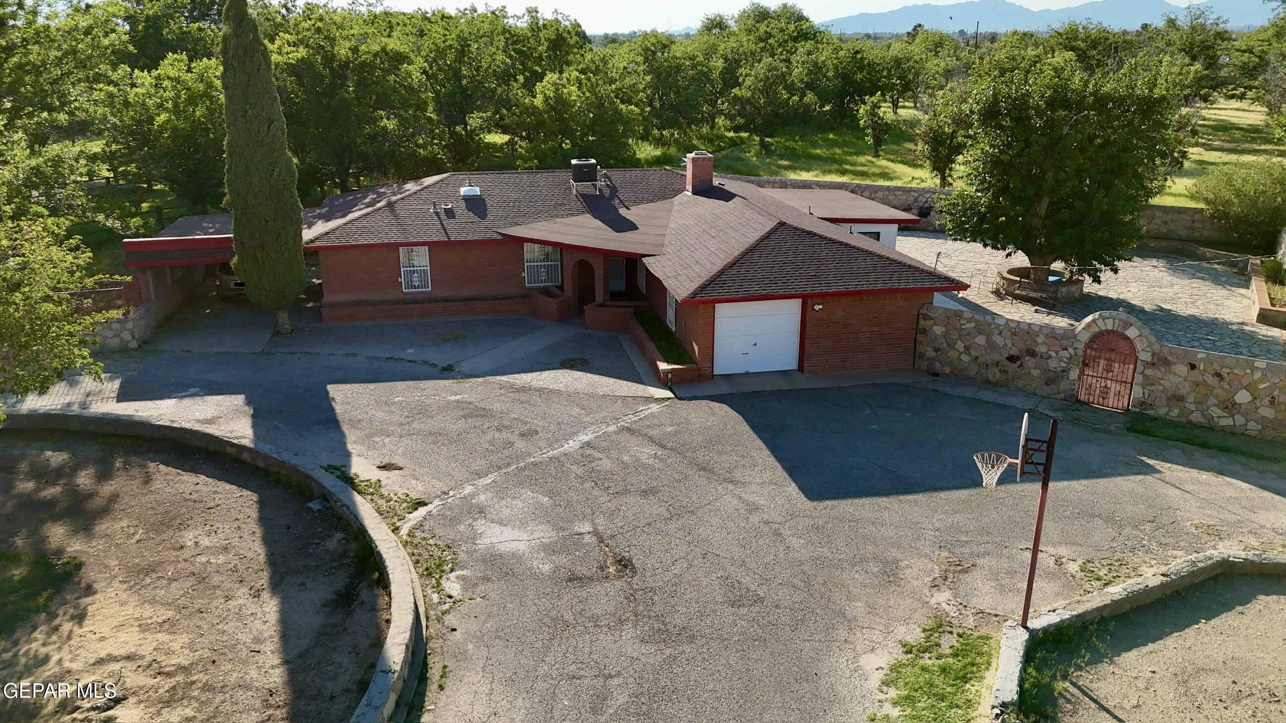 875 Le Barron Road El Paso, TX 79907 - Photo 8 of 14 a view of a house with a yard
