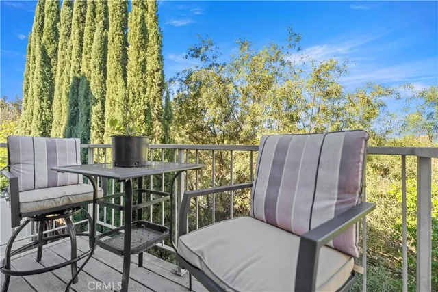 a view of balcony with furniture