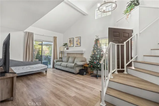 a living room with furniture fireplace and flat screen tv