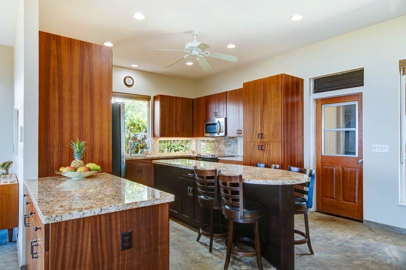 2301 Ho'ohu Road Koloa, HI 96756 - Photo 14 of 28 a kitchen with a table and chairs in it