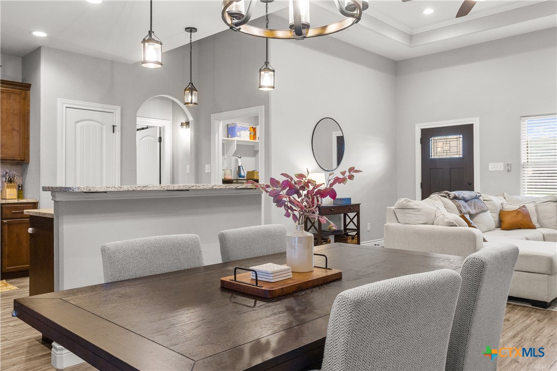 314 Blue Jay Loop Victoria, TX 77905 - Photo 7 of 27 a living room with furniture a large window and a chandelier