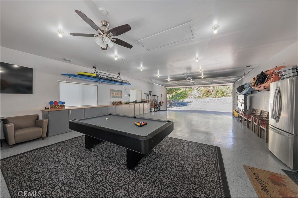 27550 North Bay Road Lake Arrowhead, CA 92352 - Photo 27 of 32 a living room with furniture and a flat screen tv