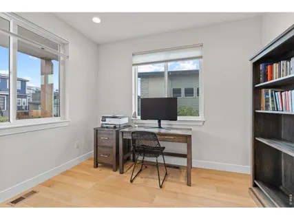 a bathroom with a sink mirror and vanity