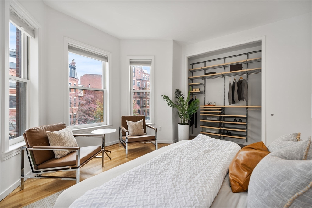 363 Marlborough Street, Unit 5 Boston, MA 02115 - Photo 14 of 23 a bedroom with a bed and a couch