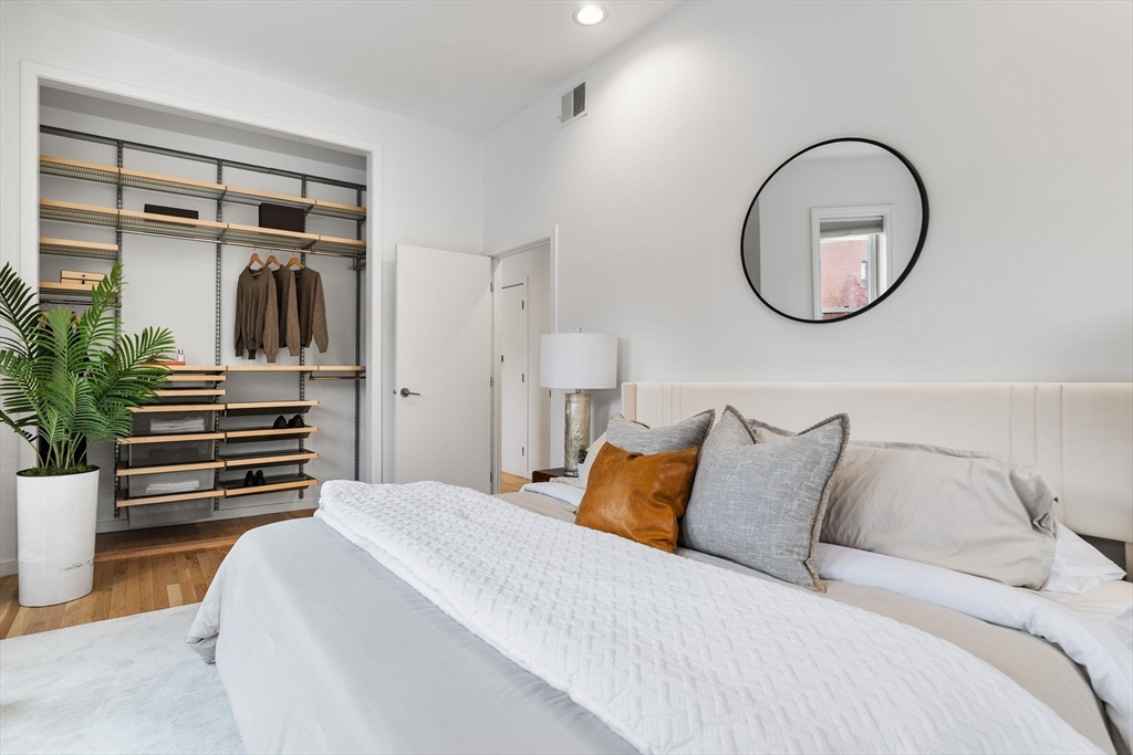 363 Marlborough Street, Unit 5 Boston, MA 02115 - Photo 16 of 23 a bedroom with a bed and a potted plant