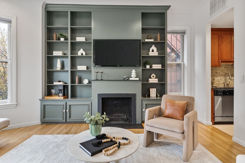 363 Marlborough Street, Unit 5 Boston, MA 02115 - Photo 5 of 23 a living room with furniture fireplace and flat screen tv