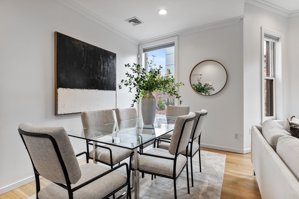 363 Marlborough Street, Unit 5 Boston, MA 02115 - Photo 7 of 23 a dining room with furniture and window