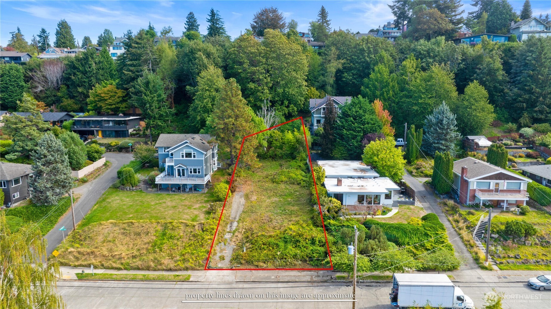 7558 45th Avenue Southwest Seattle, WA 98136 - Photo 3 of 9 an aerial view of a house with yard swimming pool and outdoor seating