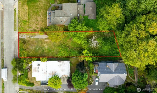 an aerial view of a house with a yard swimming pool outdoor seating and yard