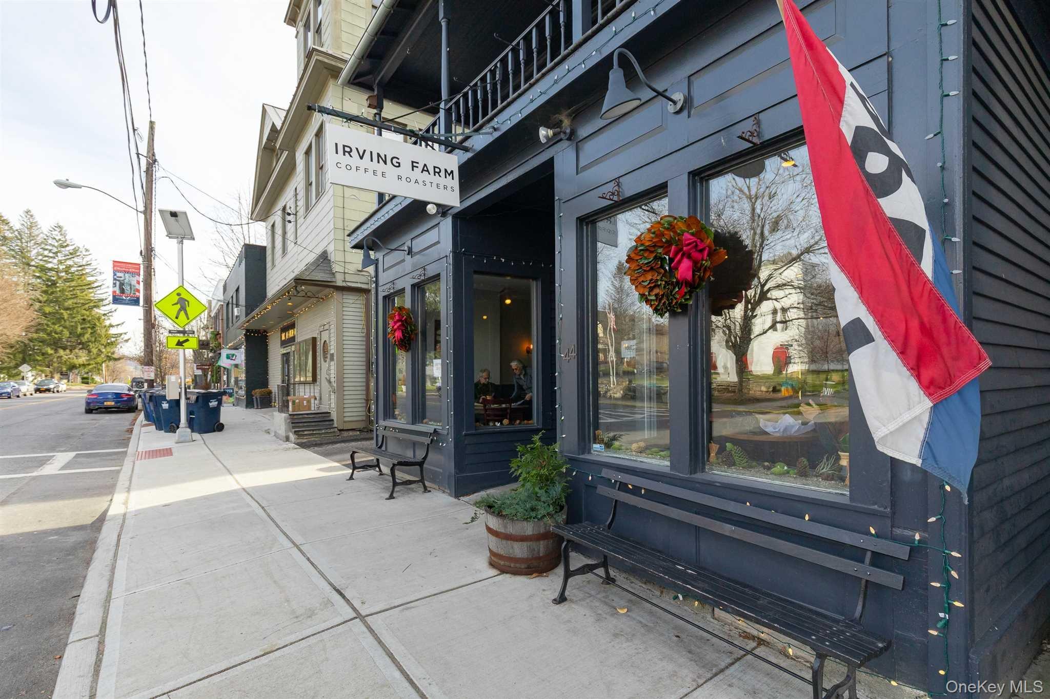a view of path along with retail shop and building