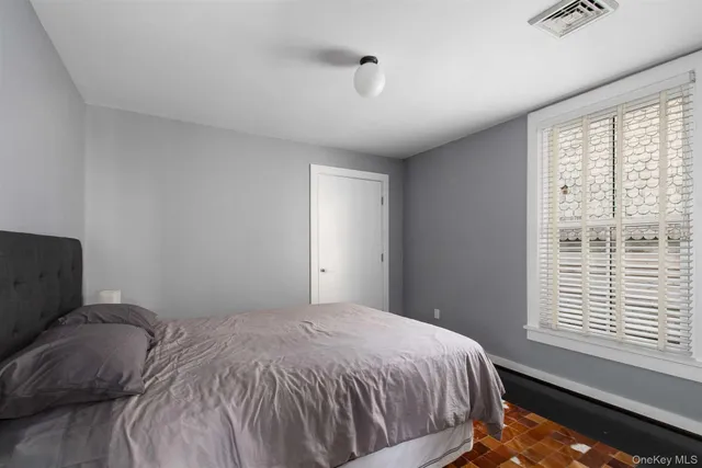 a bathroom with a toilet a sink and shower