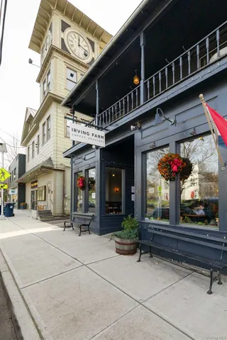 a view of a porch with chairs and backyard