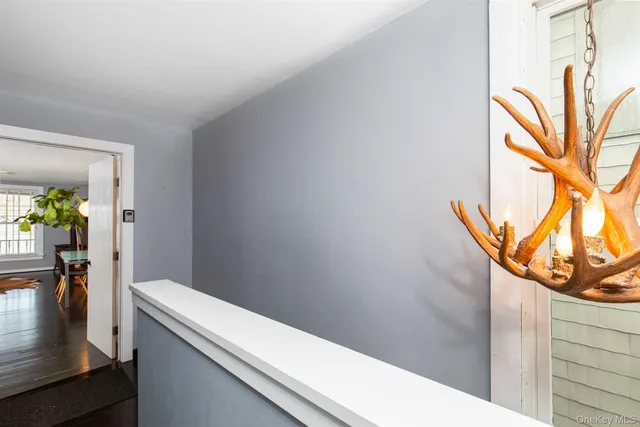 a kitchen with a table chairs microwave and cabinets