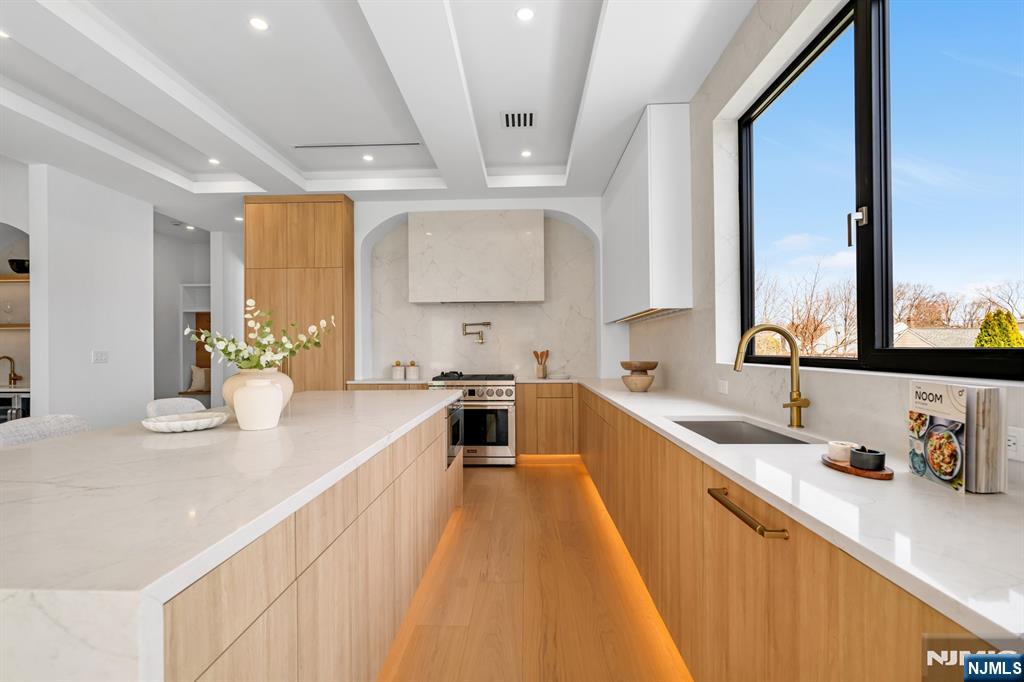 356 Bullard Avenue Paramus, NJ 07652 - Photo 17 of 50 a large white kitchen with a large window