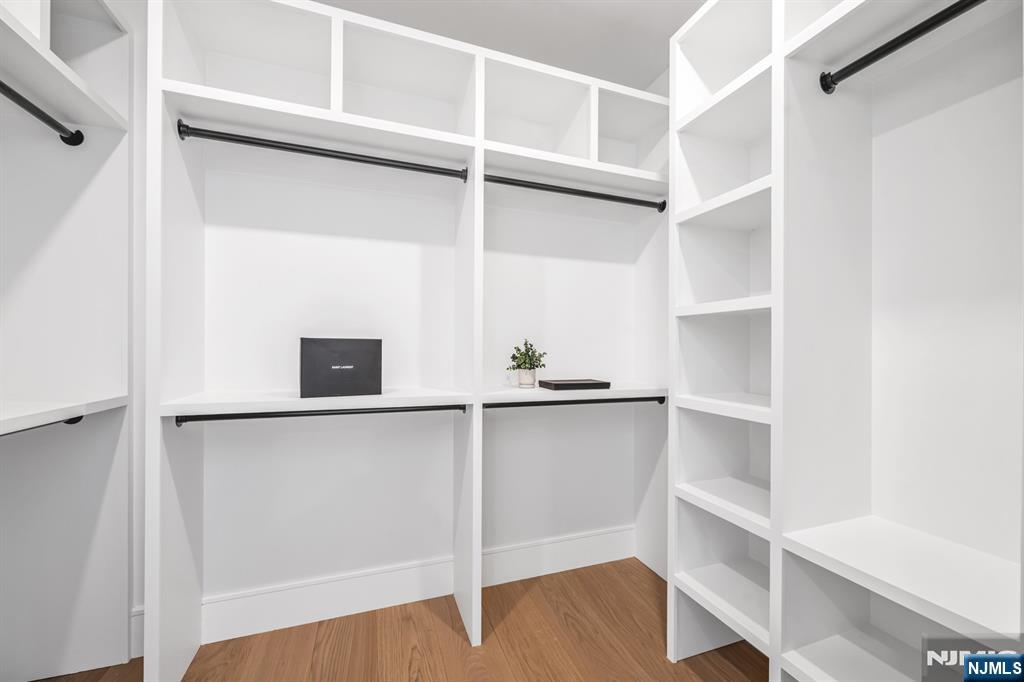356 Bullard Avenue Paramus, NJ 07652 - Photo 29 of 50 a view of an empty walk in closet with wooden floor