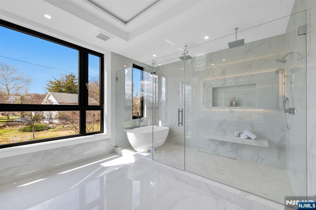 356 Bullard Avenue Paramus, NJ 07652 - Photo 33 of 50 a bathroom with a large tub and shower
