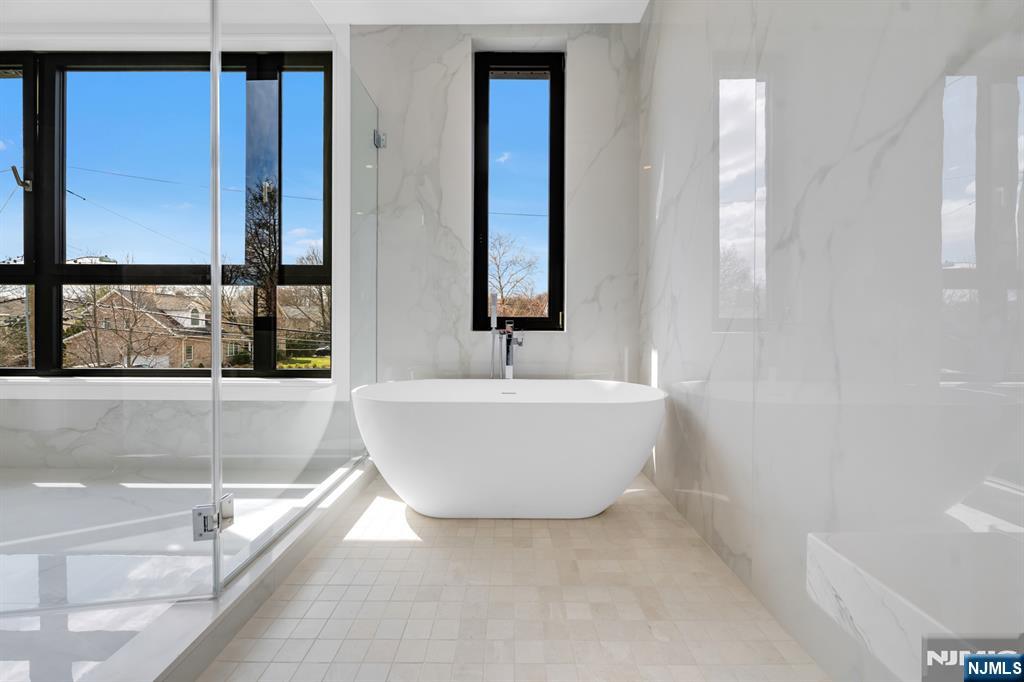 356 Bullard Avenue Paramus, NJ 07652 - Photo 34 of 50 a white bath tub sitting next to a window