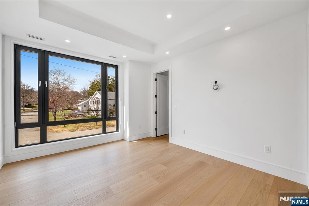356 Bullard Avenue Paramus, NJ 07652 - Photo 36 of 50 a view of gallery with wooden floor and window