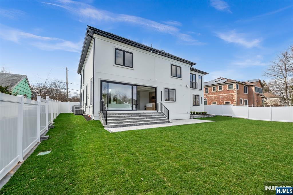 356 Bullard Avenue Paramus, NJ 07652 - Photo 48 of 50 a view of a house with a yard and sitting area