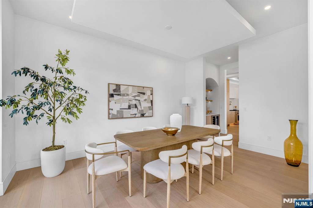 356 Bullard Avenue Paramus, NJ 07652 - Photo 7 of 50 a view of a dining room with furniture and wooden floor