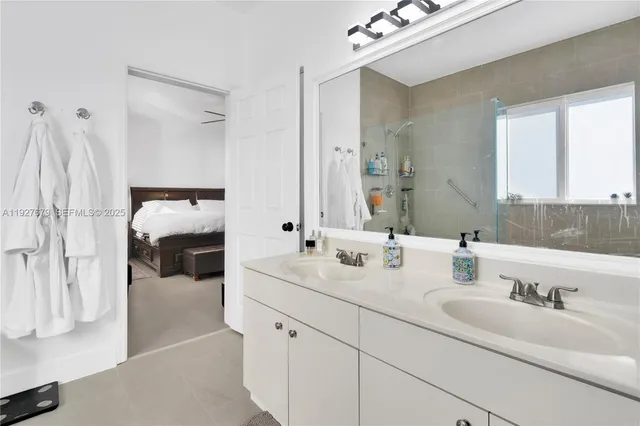 a bathroom with a double vanity sink mirror and double
